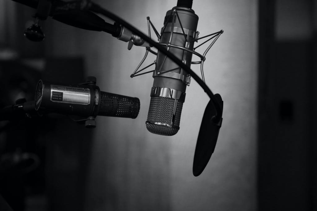 Black and white photo of several microphones.